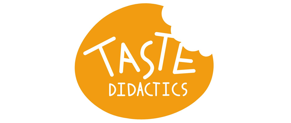 Logo: An orange oval which appears to have been taken a bite off. The white text centered in the logo says TASTE DIDACTICS in capital letters.